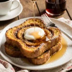 Cinnamon Roll French Toast with glaze and powdered sugar