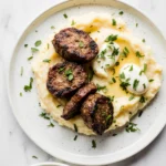 Modern plate of steak bites and mashed potatoes with clean background