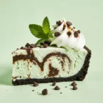 Mint ice cream pie with chocolate crust and whipped cream.